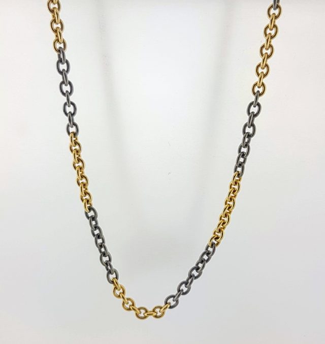 14 karaat geelgoud ketting in combi met titanium schakels #0064