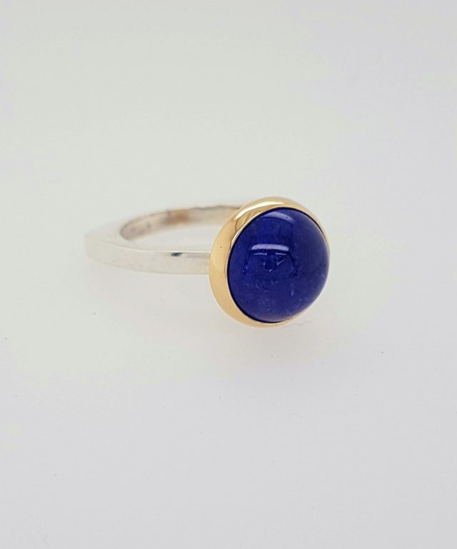 Zilveren ring met gouden zetting en Tanzaniet. Uniek product. #24403