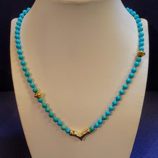 Turkoois kralenketting met gouden slot en tussenstukken #3531
