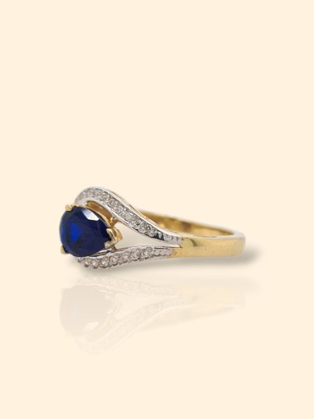 Geelgouden ring met blauwe en witte zirkonia occasion #28787 - Afbeelding 3