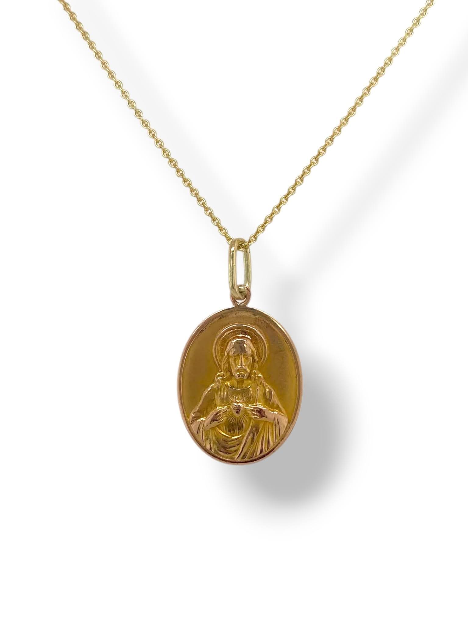 Gouden ovale religieuze medaille met Maria en kindje Jezus en Jezus Christus met Heilig Hart