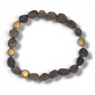 Vintage rookkwarts kralencollier met grote rookkwartsen en gehamerde gouden kralen.