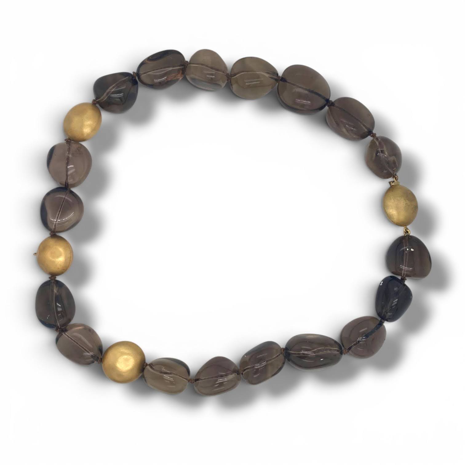 Vintage rookkwarts kralencollier met grote rookkwartsen en gehamerde gouden kralen.