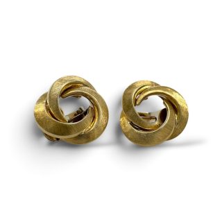 Vintage gouden oorknoppen in love knot ontwerp met clipsluiting