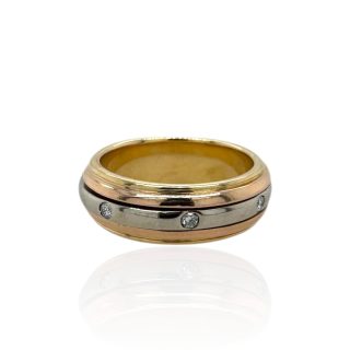 18 karaat gouden spinner ring in drie kleuren goud met acht diamantjes in de witgouden middenband.